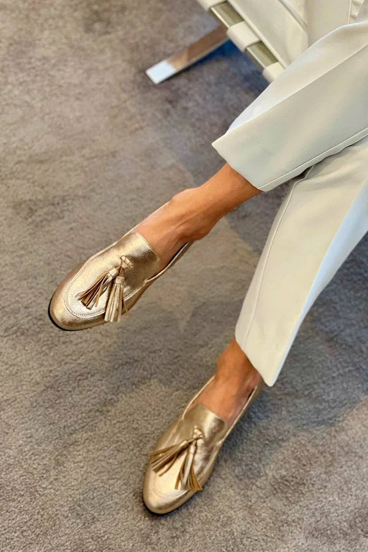 Beatrice | Gouden instappers met metallic effect en franjes