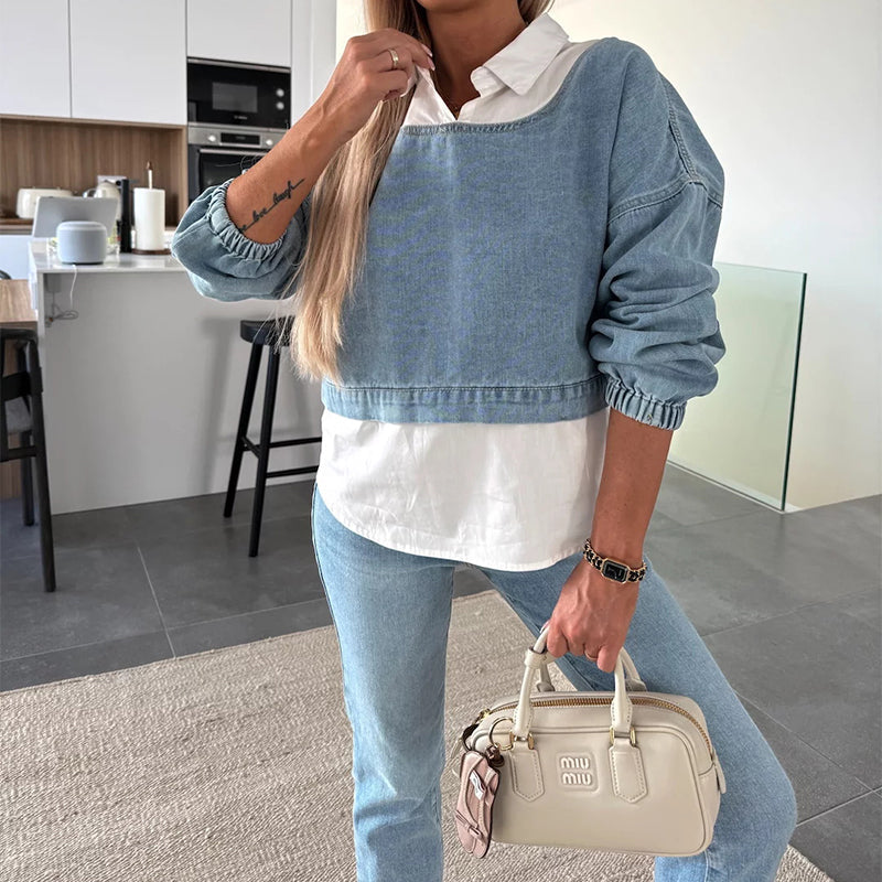 Modieuze twee-delige set bestaande uit een lange mouwen spijkerblouse en een broek voor vrouwen